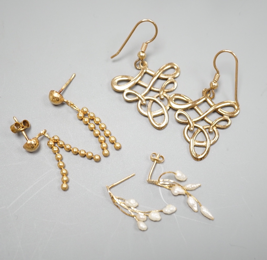 Two pairs of modern 9ct gold earrings including interwoven and tassel drop, 6.5 grams and a pair of 14k and baroque pearl drop earrings, gross 0.9 grams.